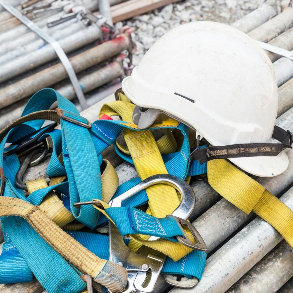 Safety helmet and safety harness at a construction site