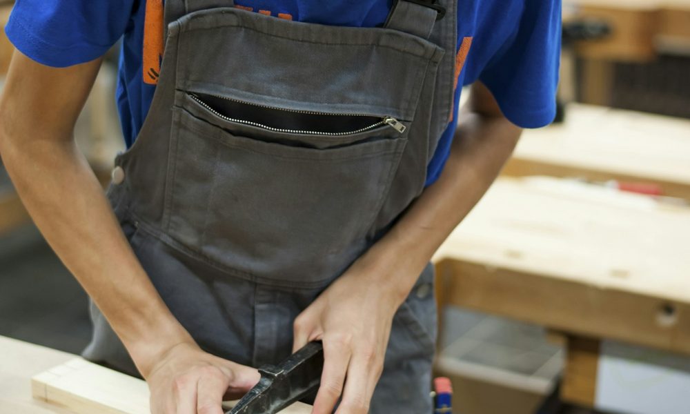 Vocational school student working in a carpenter's workshop